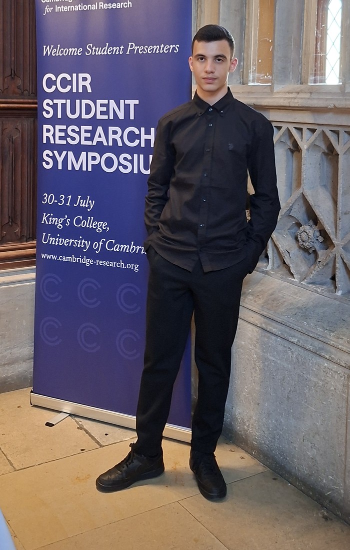 Rareș presenting at the CCIR Student Research Symposium, King's College, Cambridge